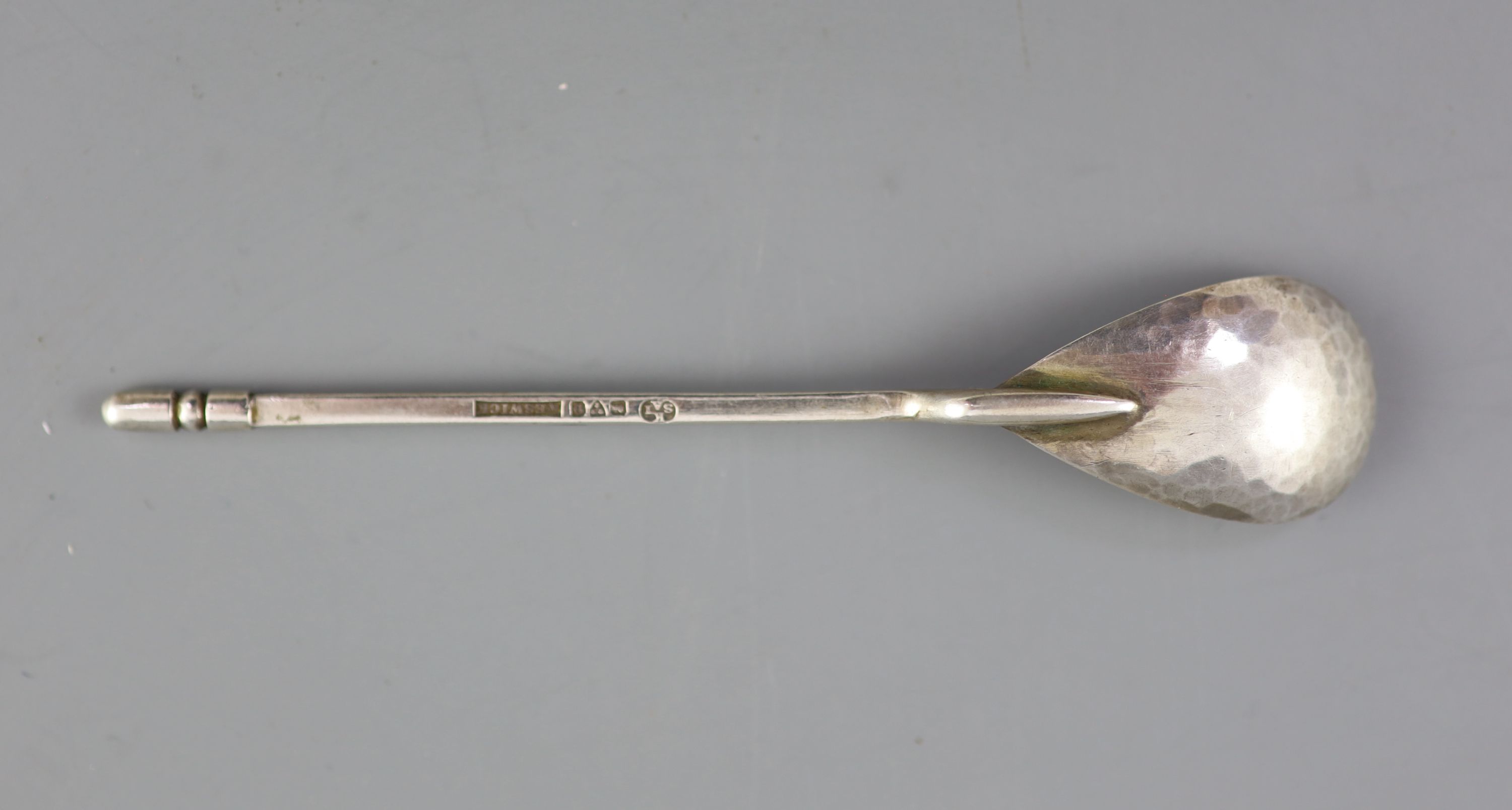 A cased set of six George V Arts & Crafts silver teaspoons, by the Keswick School of Industrial Arts